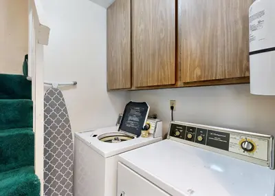 a small bathroom with a washer and dryer at The Summit E3 in South Lake Tahoe