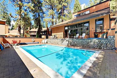 a swimming pool in front of a house at The Summit E3 in South Lake Tahoe
