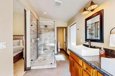 a bathroom with a shower and a sink and a toilet at Pooewin Place in South Lake Tahoe