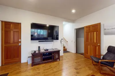 a living room with a flat screen tv on the wall at High Meadow Storybook in South Lake Tahoe