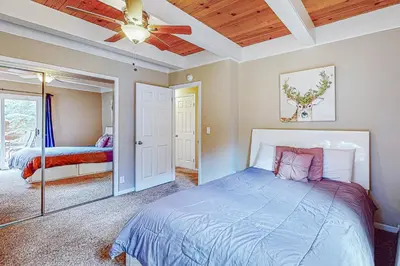 a bedroom with a bed and a ceiling fan at Montgomery Estates Retreat in South Lake Tahoe