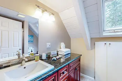 a bathroom with a sink and a mirror at Montgomery Estates Retreat in South Lake Tahoe