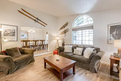 a living room with two couches and a table at Montgomery Estates Ski & Beach Haven in South Lake Tahoe
