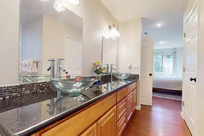 a bathroom with two bowl sinks on a counter at Cellador Charms in South Lake Tahoe