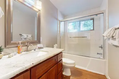 a bathroom with a sink and a toilet and a shower at Cellador Charms in South Lake Tahoe