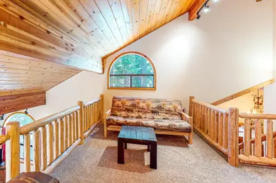 a living room with a couch and a table at The Bear's Lair House in Truckee