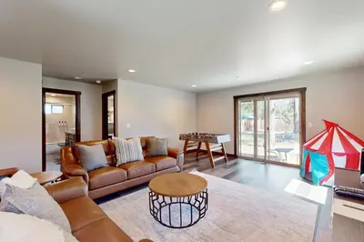 a living room with a couch and a table at Arrowhead Adventures in South Lake Tahoe