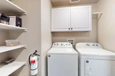 a laundry room with a washer and dryer at Arrowhead Adventures in South Lake Tahoe