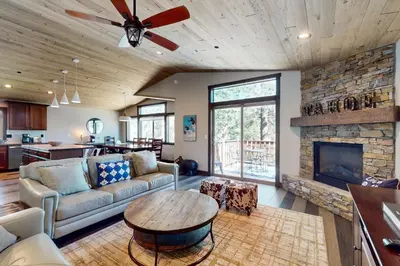 a living room with a couch and a fireplace at Arrowhead Adventures in South Lake Tahoe