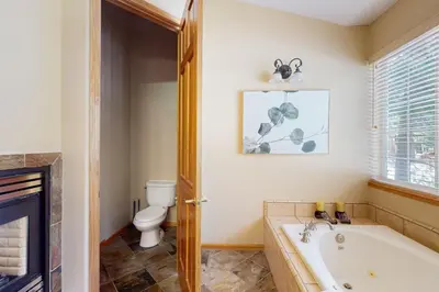 a bathroom with a bath tub and a toilet at Cochise Adventures in South Lake Tahoe
