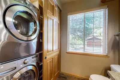 a washer and dryer in a kitchen with a window at Cochise Adventures in South Lake Tahoe