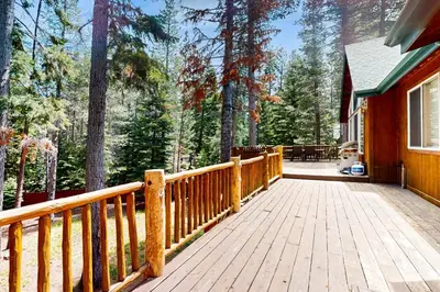 a wooden porch of a house with a wooden fence at Cochise Adventures in South Lake Tahoe