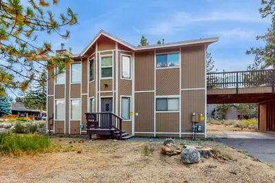 a large house with a porch and a balcony at Azure Palace in South Lake Tahoe