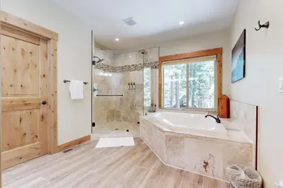 a large bathroom with a tub and a shower at Thunderbird Palace in South Lake Tahoe