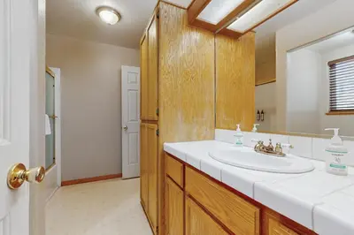 a bathroom with a sink and a mirror at Backyard Oasis in South Lake Tahoe