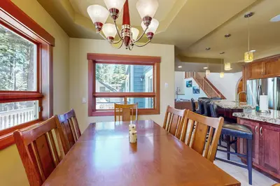 a dining room with a wooden table and chairs at Cherry Hill Charms in South Lake Tahoe