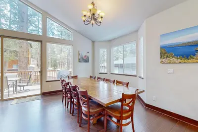 a dining room with a wooden table and chairs at Jacarillo Escape in South Lake Tahoe