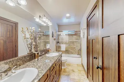 a bathroom with two sinks and a tub at Jacarillo Escape in South Lake Tahoe