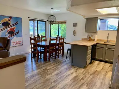 a kitchen and dining room with a table and chairs at Rr-edgewater04 in June Lake