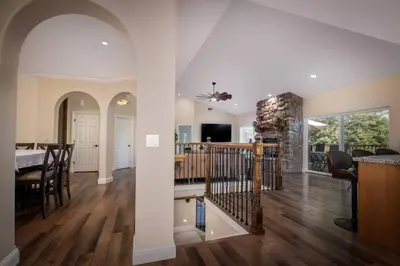 a living room and dining room of a home at New Luxury 5BR Cabin in Pine Mountain Lake! 1 Minute to Beach! Massage Chair! Close to Yosemite! Perfect for Retreats and Escapes All Seasons! in Groveland