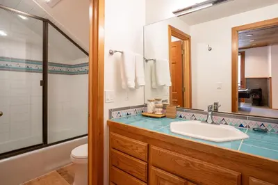 a bathroom with a sink and a mirror at Creekside at Northstar home in Truckee