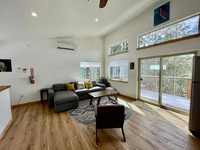 a living room with a couch and a table at Ravens Lair in Yosemite West
