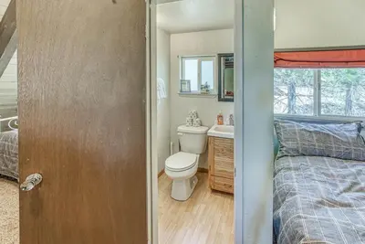 a small bathroom with a toilet and a sink at Livin' The Dream at 7000 ft in Lakeshore