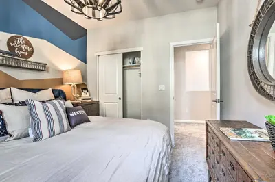 a bedroom with a large bed and a mirror at Relaxing Roseville Home with Outdoor Amenities in Roseville