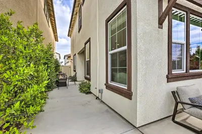 a walkway next to a building with windows at Relaxing Roseville Home with Outdoor Amenities in Roseville
