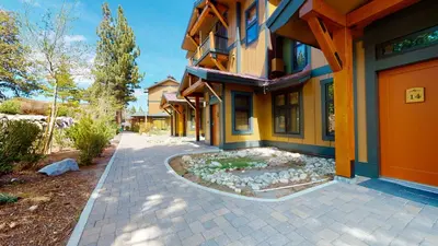 a house with a walkway in front of it at Solstice #14 condo in Mammoth Lakes