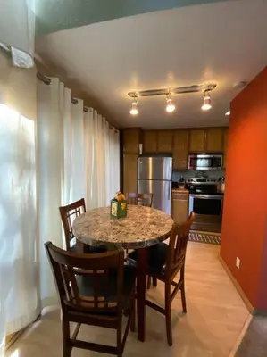 a kitchen with a table and chairs and a kitchen with a kitchen at Mammoth Awesome Location-1 min to Shuttles & Food! TOML-CPAN-11402 in Mammoth Lakes