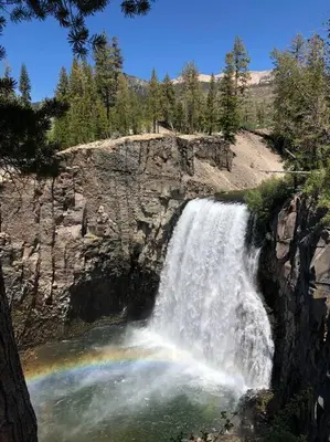 a waterfall on the side of a rocky mountain at Mammoth Awesome Location-1 min to Shuttles & Food! TOML-CPAN-11402 in Mammoth Lakes