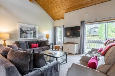 a living room with two couches and a table at Snowcreek IV 549 in Mammoth Lakes