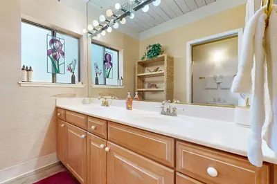 a bathroom with a sink and a mirror at All-Season Getaway in Kings Beach
