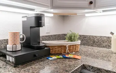a kitchen with a coffee maker on a counter at Boho Townhome in Carson City 10 Mins From Downtown, 30 Mins To Lake Tahoe in Carson City