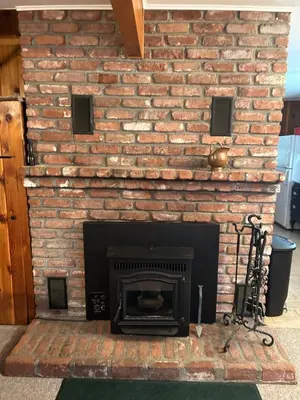 a brick fireplace with a fire place at Sequoia National Forest Cabin-ATV Ride in Panorama Heights