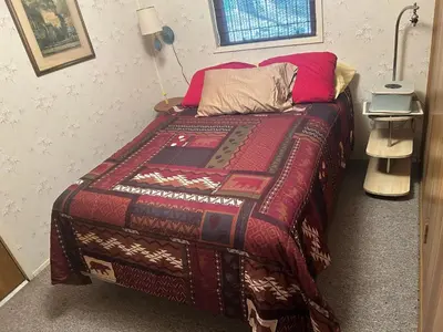 a bedroom with a bed with a colorful blanket at Sequoia National Forest Cabin-ATV Ride in Panorama Heights