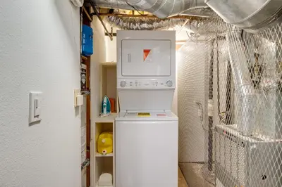 a washer and dryer in a room at Ski and Hike Cozy Dtwn Reno Studio with Fireplace in Reno