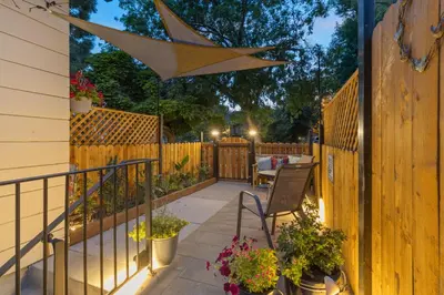 a patio with a fence and a table and chairs at Ski and Hike Cozy Dtwn Reno Studio with Fireplace in Reno