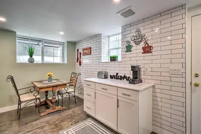 a kitchen with a counter and a table and chairs at Ski and Hike Cozy Dtwn Reno Studio with Fireplace in Reno