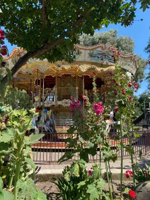 a carousel at a park with flowers at Casa de Fruta Cabins, Inn & RV Park in Hollister