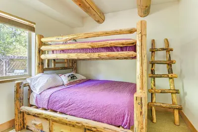 a bedroom with two bunk beds and a ladder at 2 Cabins Group and Family Getaway in Arnold! in Arnold