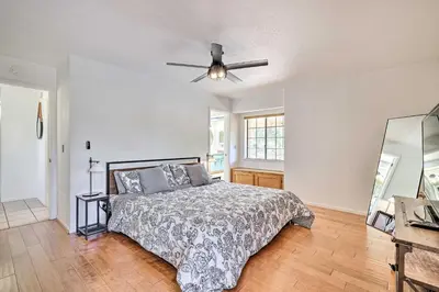 a bedroom with a bed and a ceiling fan at Balcony and Scenic View Sonora Hideaway! in Sonora