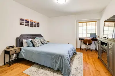 a bedroom with a bed and a desk in it at Balcony and Scenic View Sonora Hideaway! in Sonora
