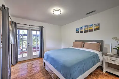 a bedroom with a bed and a balcony at Balcony and Scenic View Sonora Hideaway! in Sonora