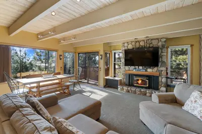 a living room with a couch and a fireplace at Val D'Isere at the Village by 101 Great Escapes in Mammoth Lakes