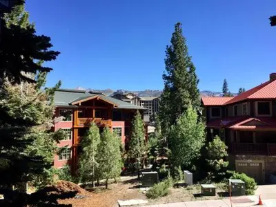 a large house with trees in front of it at Val D'Isere at the Village by 101 Great Escapes in Mammoth Lakes