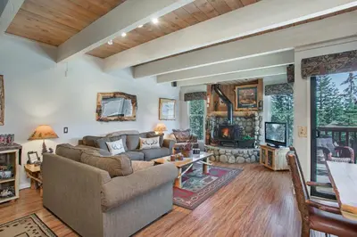 a living room with a couch and a fireplace at Val D'Isere at the Village by 101 Great Escapes in Mammoth Lakes