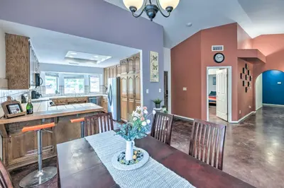 a kitchen and dining room with a table and chairs at Charming Home Less Than 10 Mi to Sequoia Natl Park! in Three Rivers