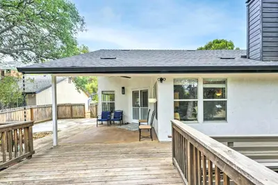 a house with a deck with chairs on it at Charming Home Less Than 10 Mi to Sequoia Natl Park! in Three Rivers